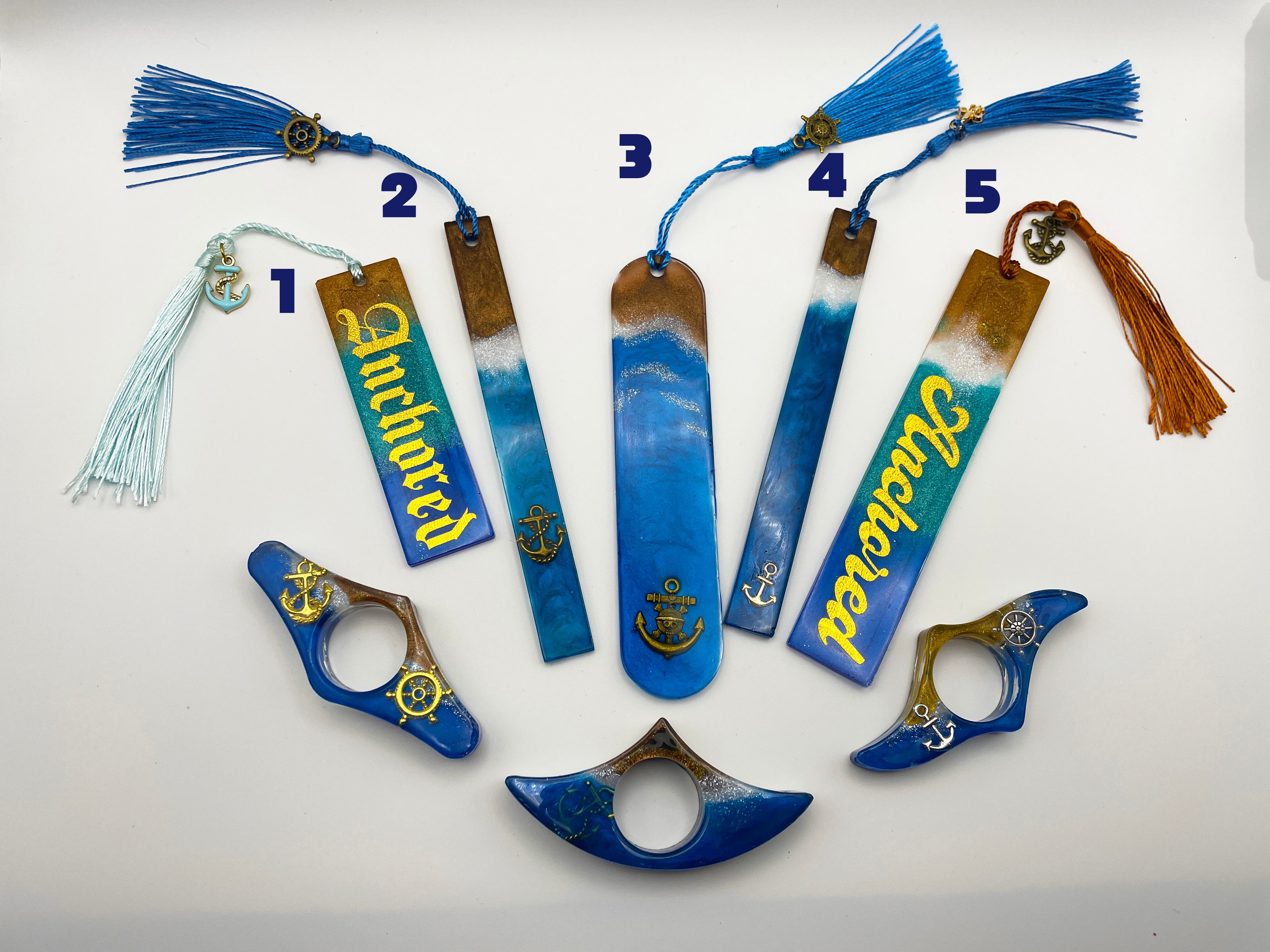 Set of decorative bookmarks with tassels on a white background
